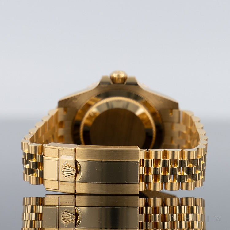 Rolex GMT-Master II 126718GRNR — Black Dial Yellow Gold Jubilee 40mm