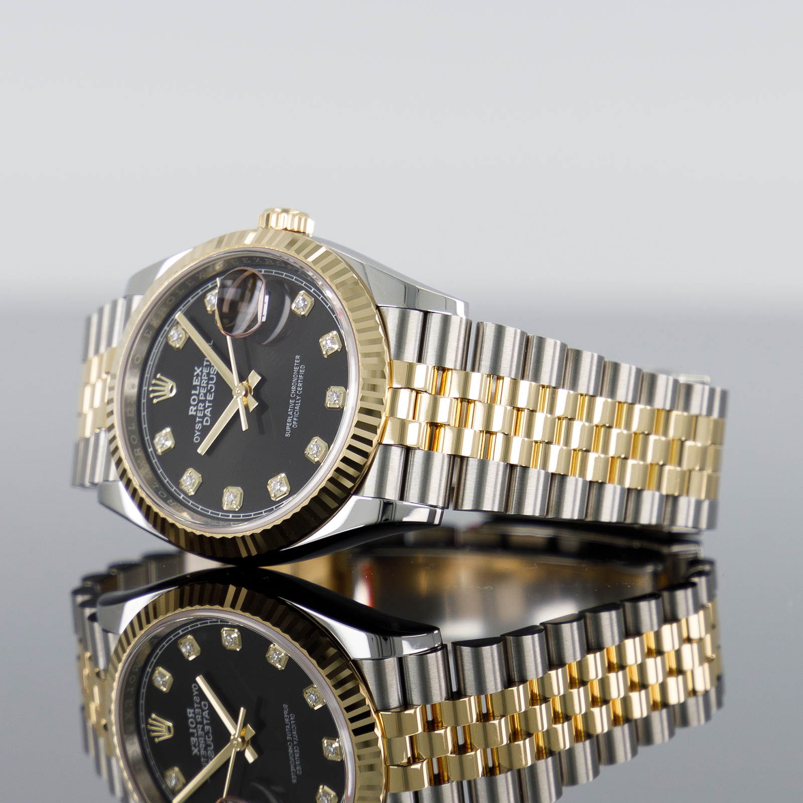 Rolex Datejust 126233 — Gold Fluted Black Diamond Dial Yellow Gold Steel Diamond 36mm