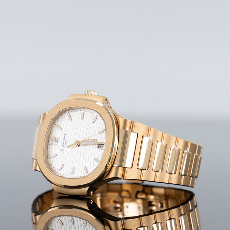 Patek Philippe Nautilus 7118/1R — Rose Gold Silvery Opaline Dial Rose Gold 35.2mm